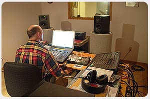 Randy sitting at control desk